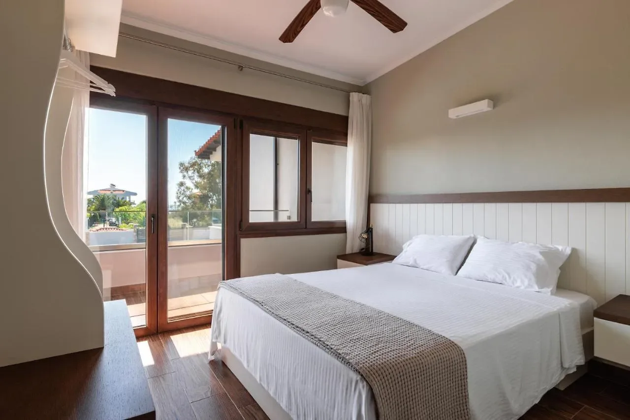 King bedroom with a balcony door and ceiling fan