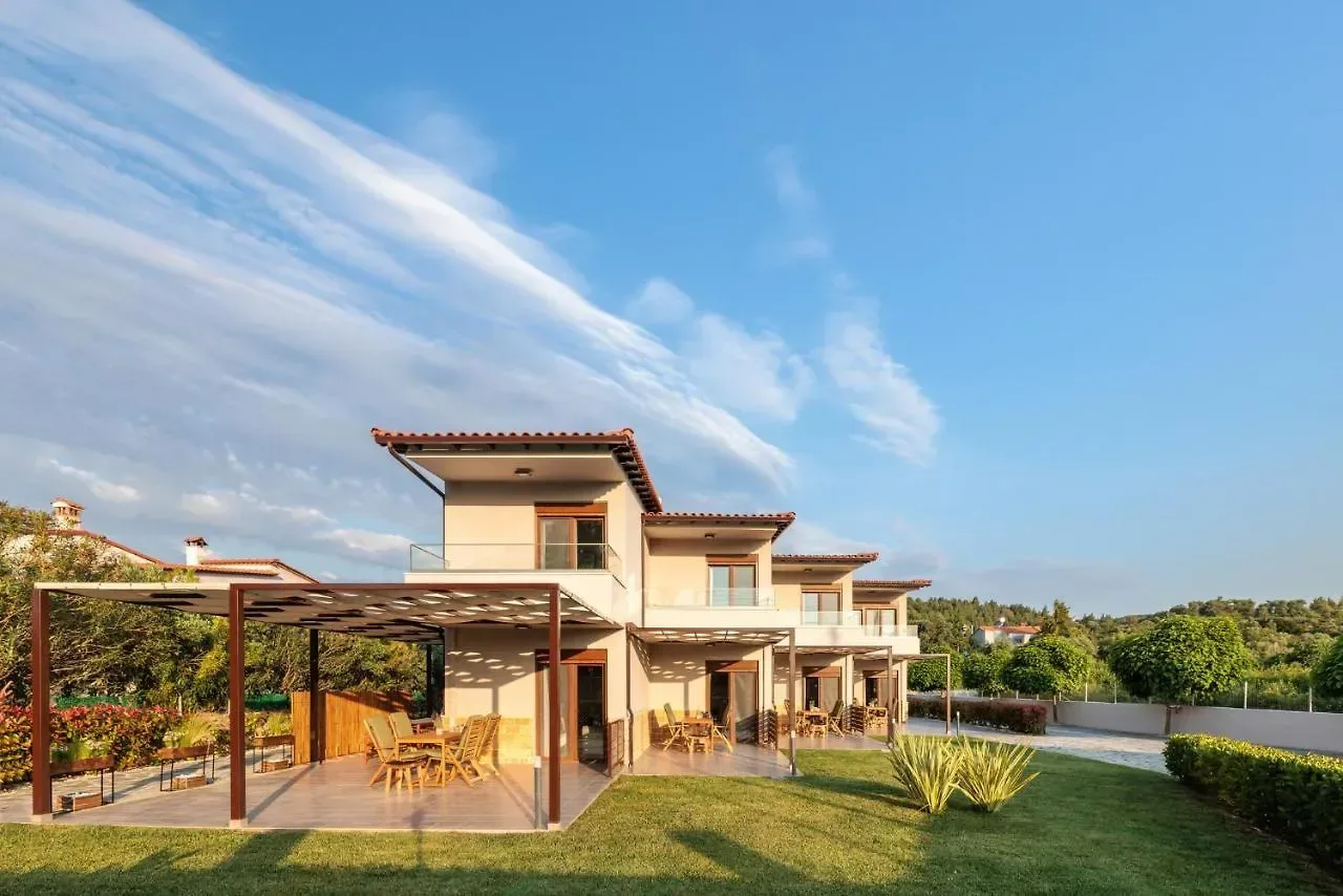 The villas seen from the garden in the late afternoon